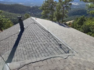 completed asphalt roof with multiple slopes and transitions