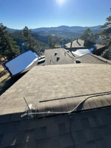 completed asphalt roof viewed from an adjacent roof plane