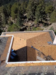 an opened roof area revealing a concealed decking condition